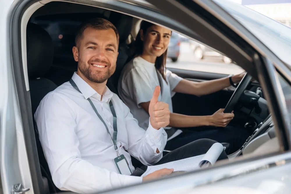 Driving school instructor with student in the car in Bishop Auckland